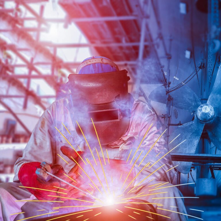 Welding ship Repair at floating dry dock on propeller background in shipyard, for hull steel worker with spark light wearing protective for safety concept when worker.